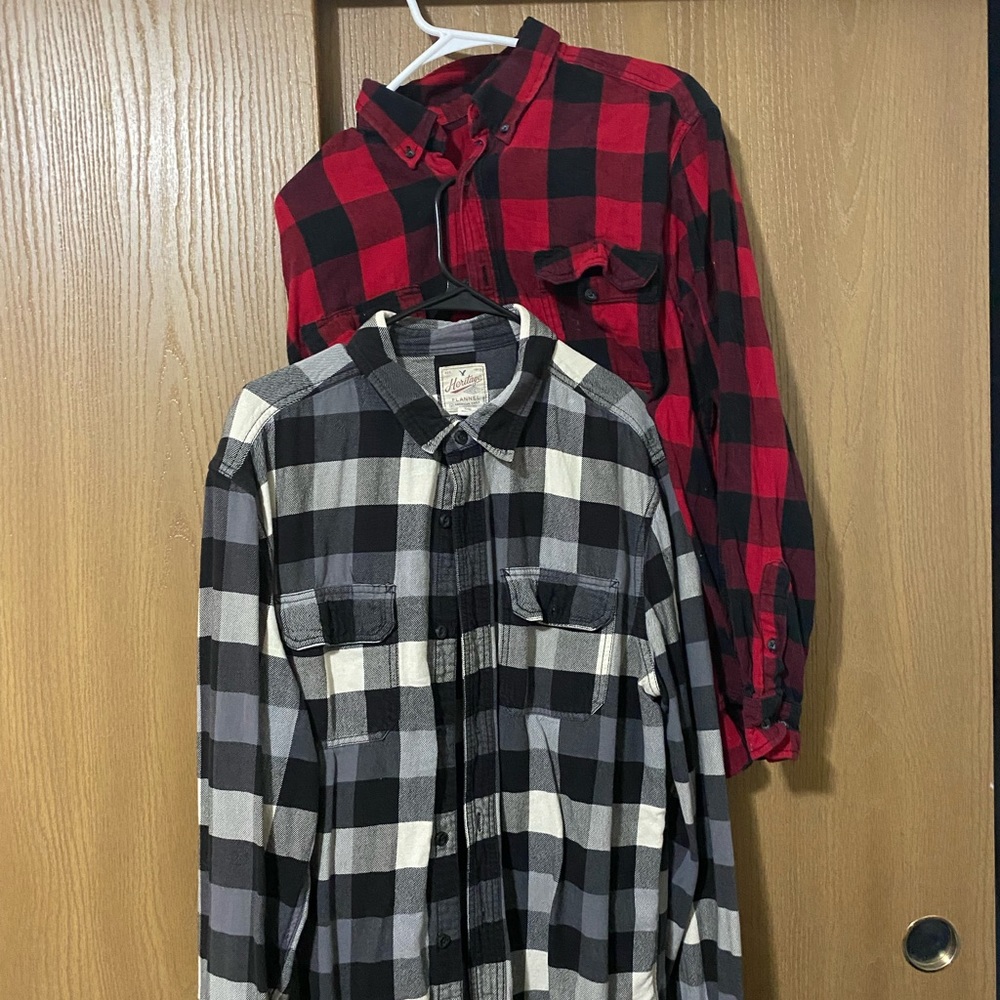 One red and one black and white flannel